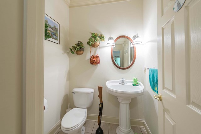2121 Lee Road Salem, AL 36874 - Photo 11 of 29 a bathroom with a toilet sink and mirror