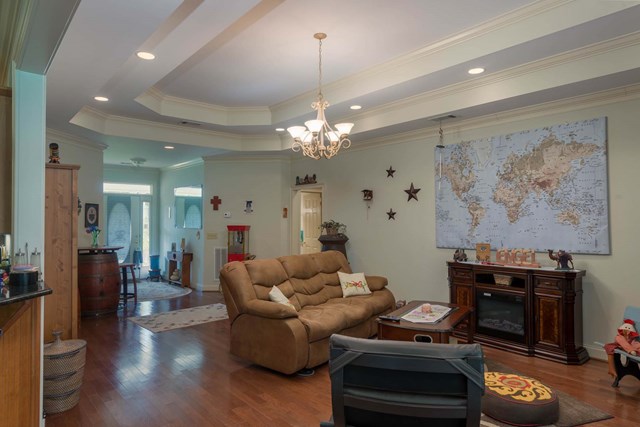 2121 Lee Road Salem, AL 36874 - Photo 4 of 29 a living room with furniture and a chandelier