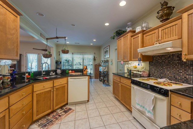2121 Lee Road Salem, AL 36874 - Photo 5 of 29 a kitchen with stainless steel appliances a sink stove and cabinets