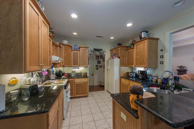 2121 Lee Road Salem, AL 36874 - Photo 6 of 29 a kitchen with kitchen island granite countertop a sink and counter space