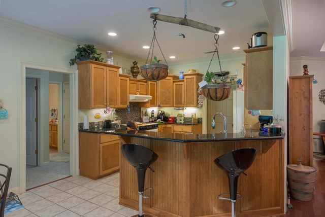 2121 Lee Road Salem, AL 36874 - Photo 8 of 29 a kitchen with stainless steel appliances granite countertop sink stove and refrigerator