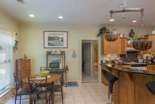 2121 Lee Road Salem, AL 36874 - Photo 10 of 29 a kitchen with a table and chairs in it