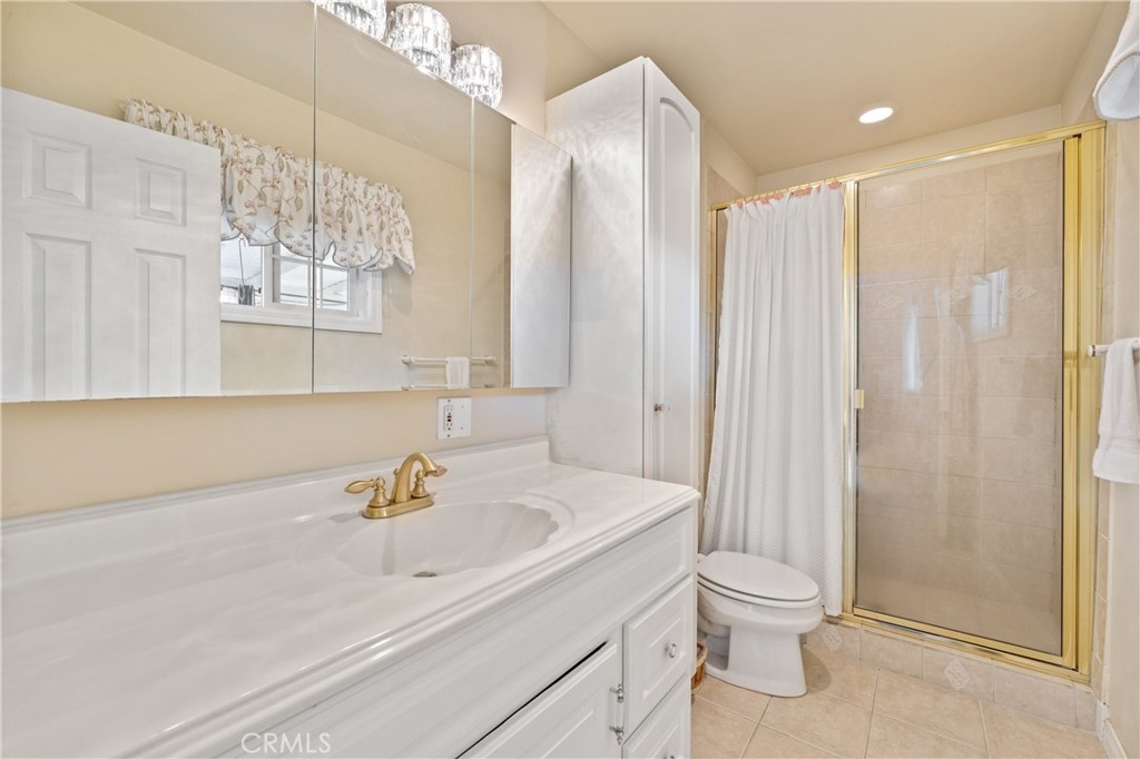 3008 Cisco Court Simi Valley, CA 93063 - Photo 19 of 34 Primary bath with tile shower, tile floor, extra storage cabinet & view of the yard