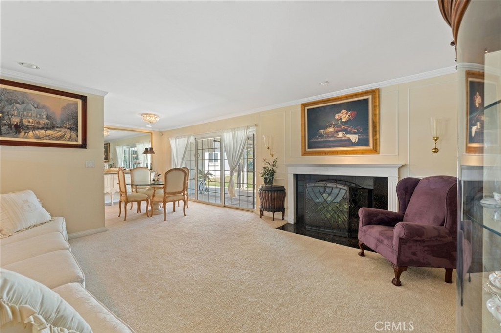 3008 Cisco Court Simi Valley, CA 93063 - Photo 10 of 34 Living room with granite surround fireplace & a view of the yard