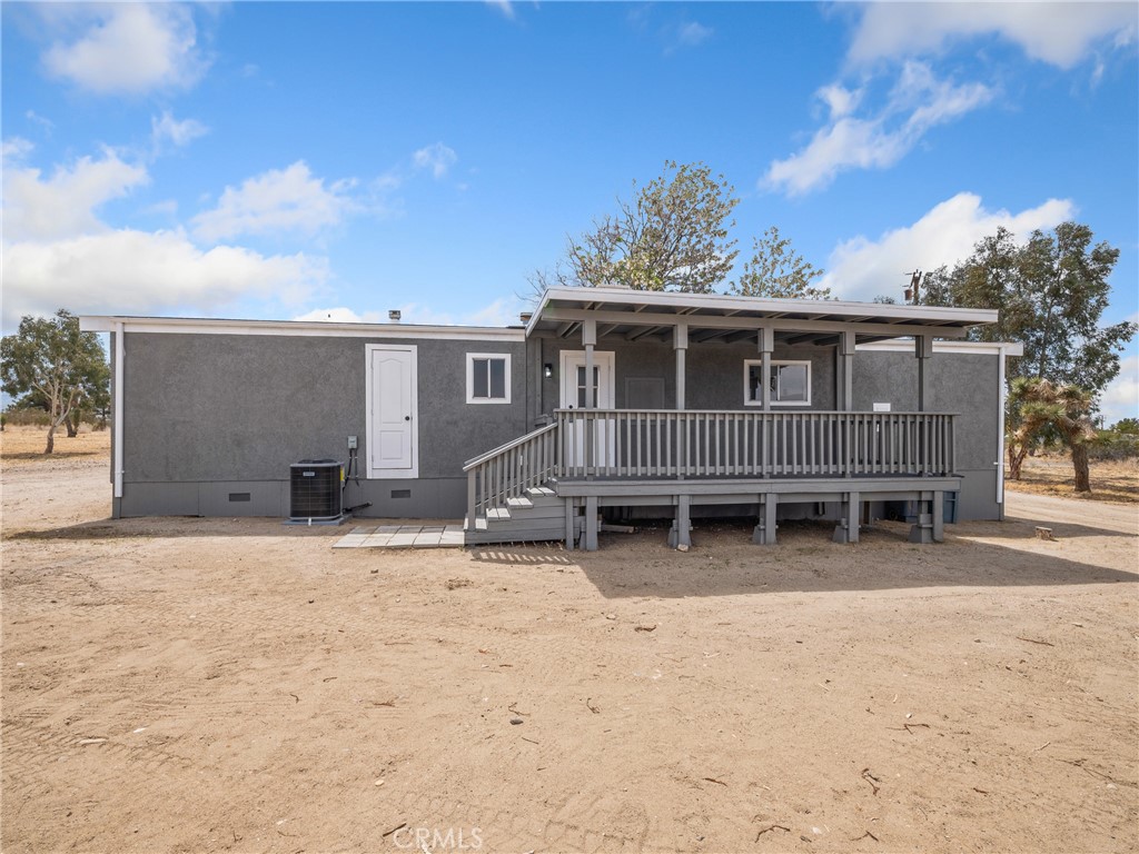 11669 Sahara Road Phelan, CA 92371 - Photo 23 of 34 a backyard of a house with table and chairs