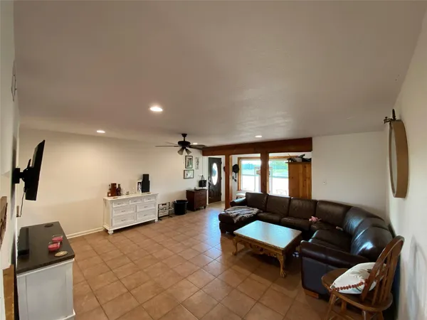 a living room with furniture and a window