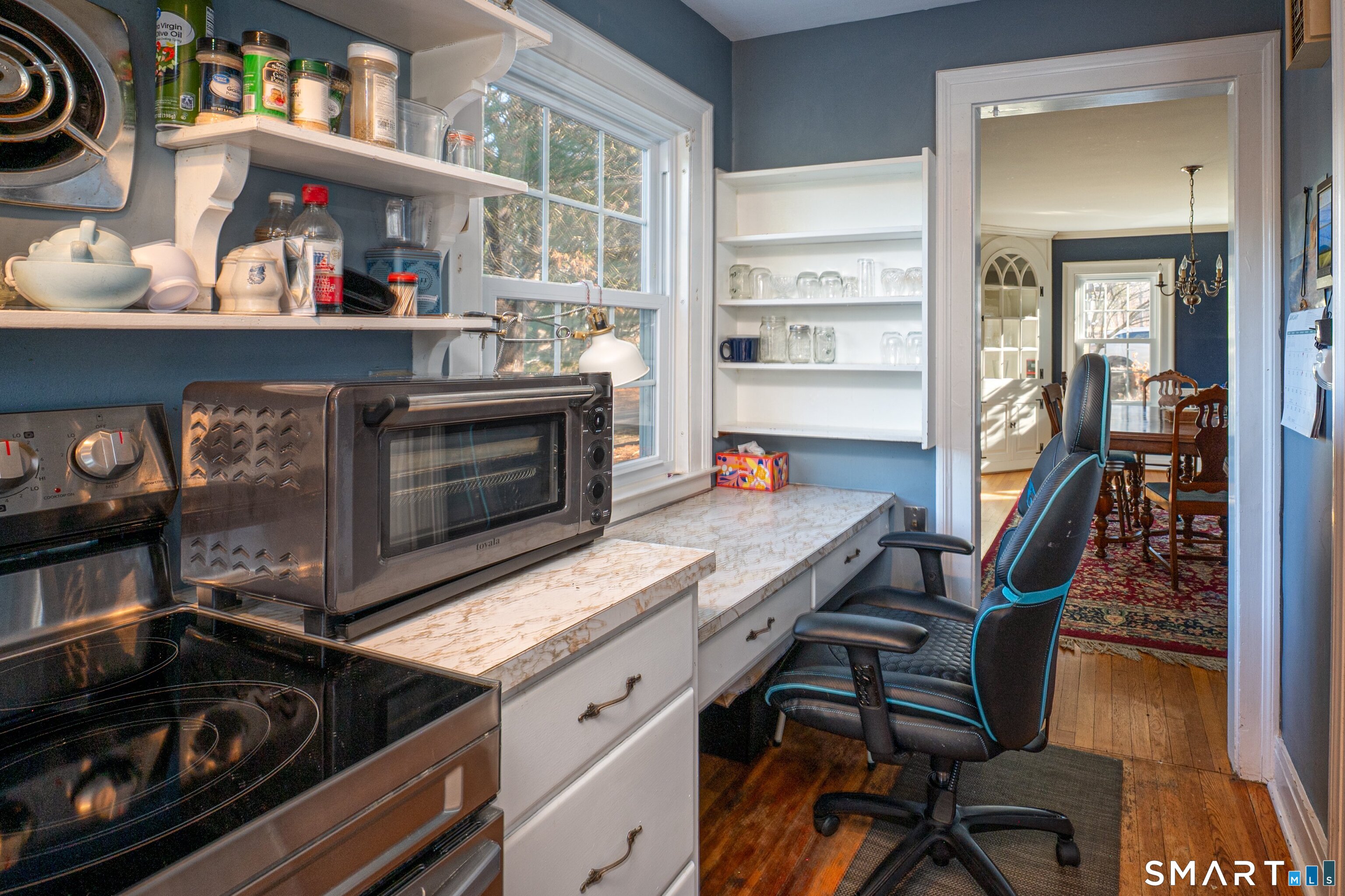 570 North Main Street Wallingford, CT 06492 - Photo 13 of 40 a kitchen with granite countertop a stove and a wooden floor