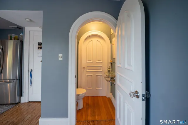 a bathroom with a sink a mirror and toilet