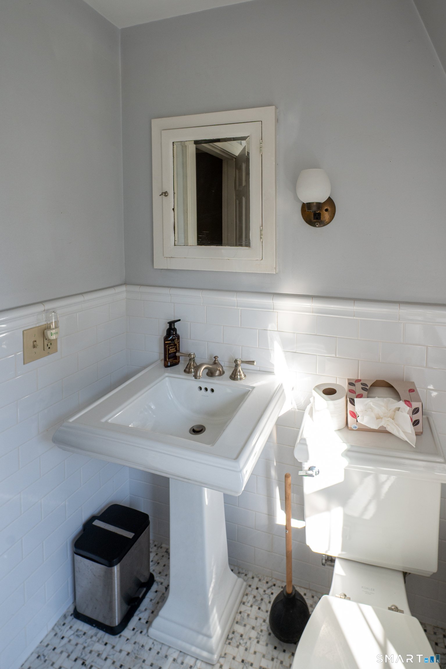 570 North Main Street Wallingford, CT 06492 - Photo 16 of 40 a bathroom with a sink and a mirror