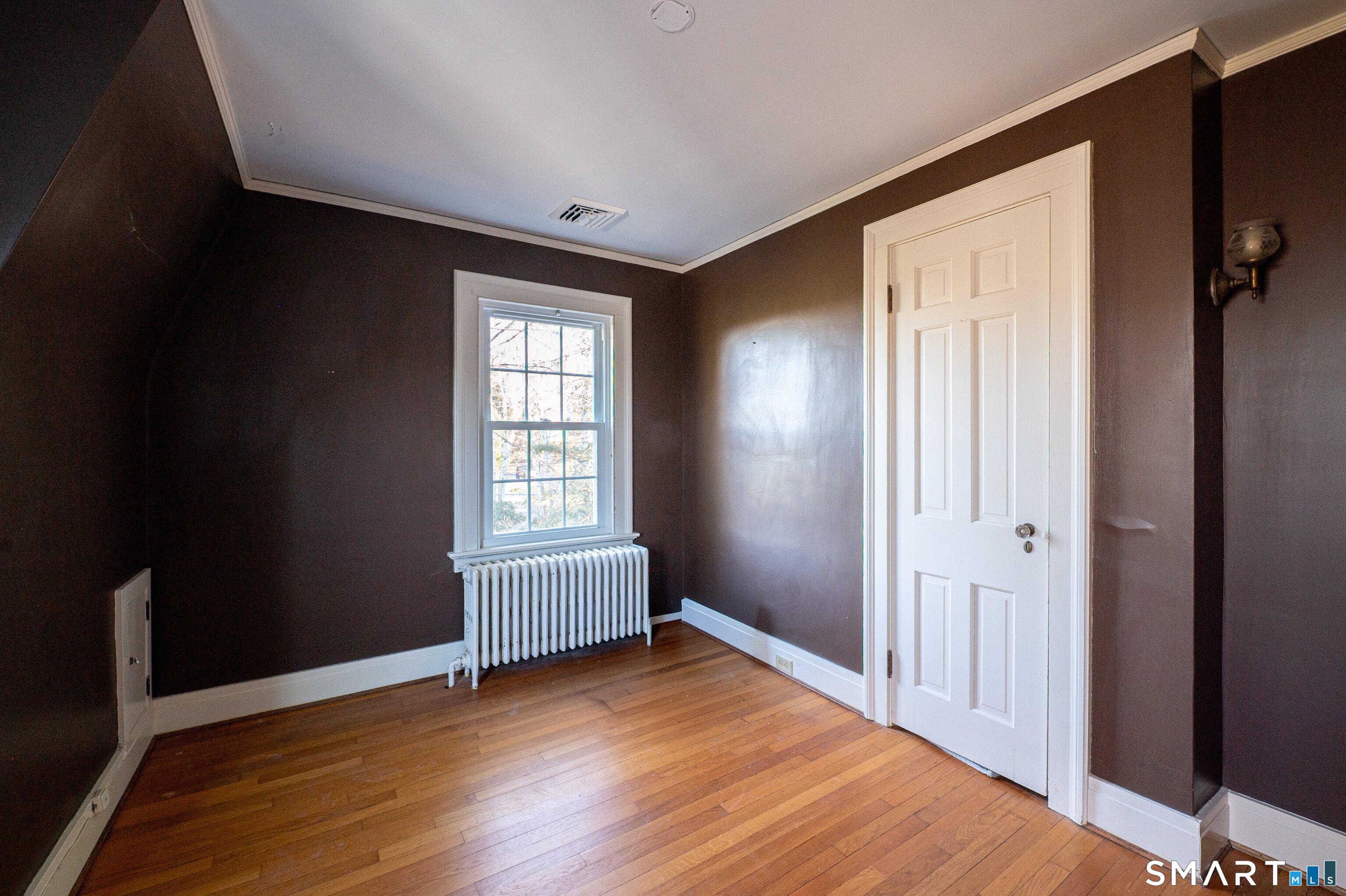 570 North Main Street Wallingford, CT 06492 - Photo 23 of 40 an empty room with wooden floor and windows