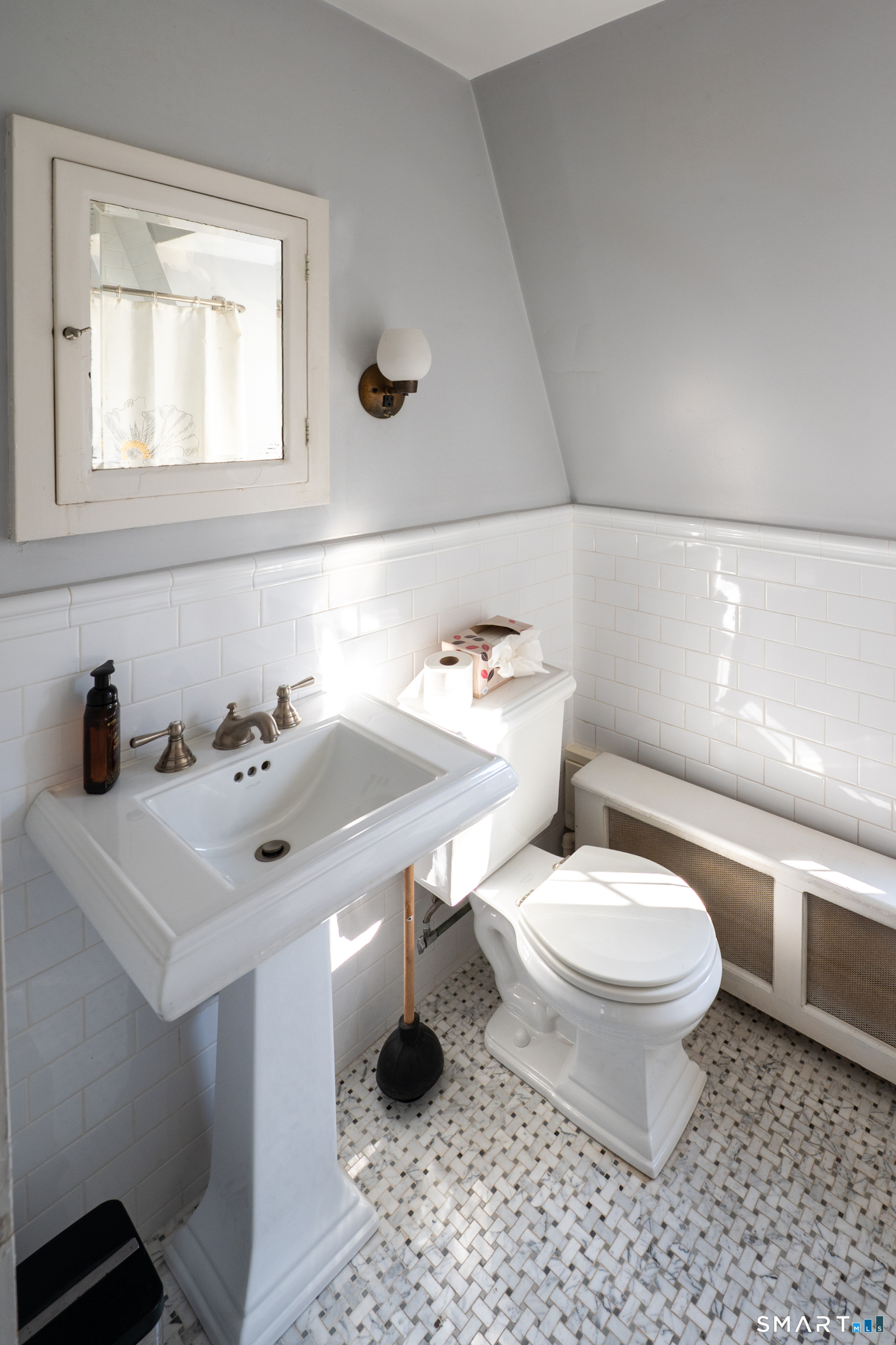 570 North Main Street Wallingford, CT 06492 - Photo 29 of 40 a bathroom with a sink toilet and mirror