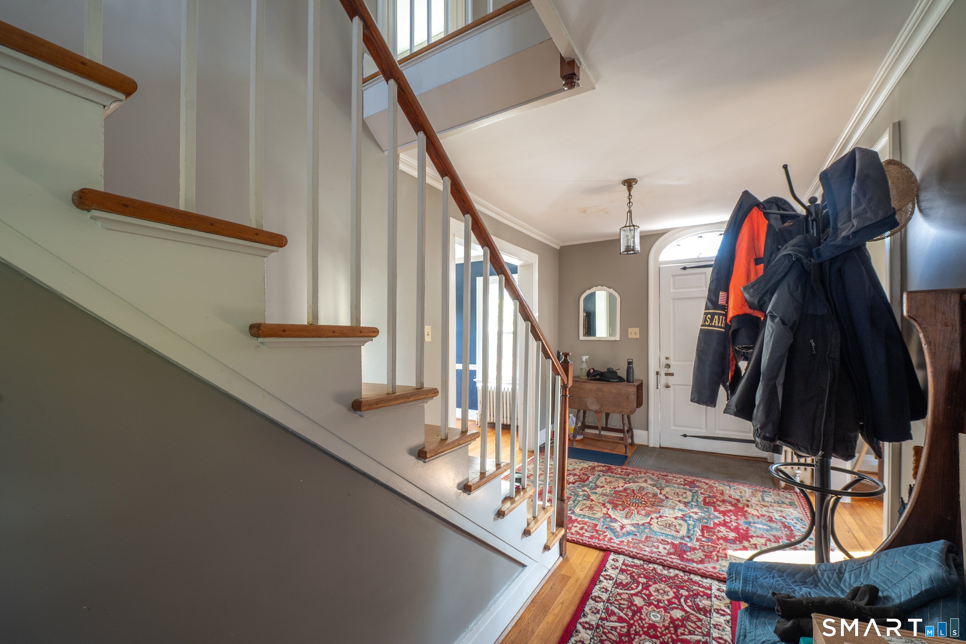 570 North Main Street Wallingford, CT 06492 - Photo 31 of 40 a view of a hallway with wooden floor and stairs