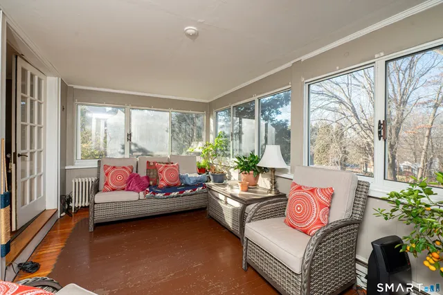 a bedroom with bed and a couch