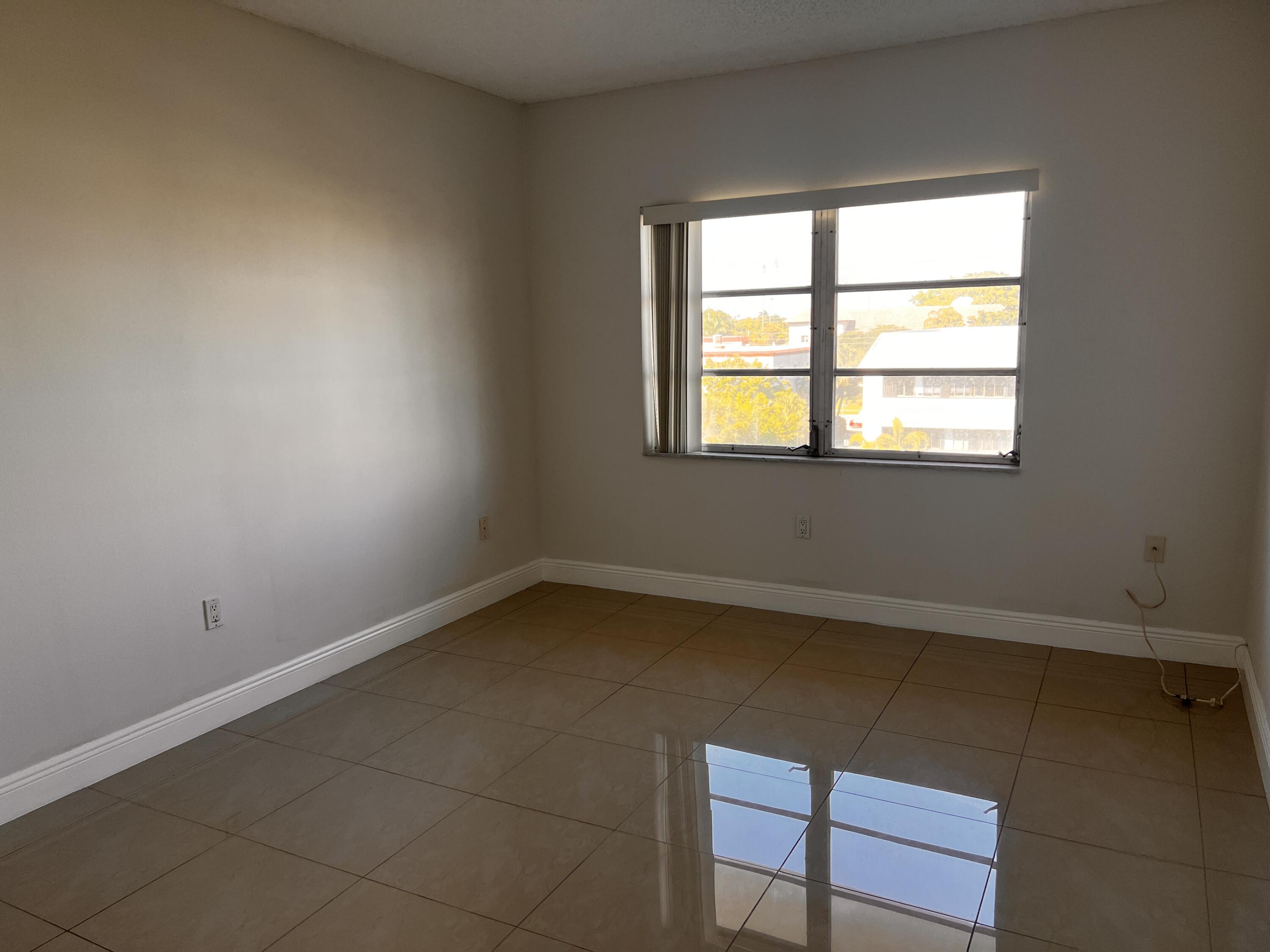 55 Southwest 2nd Avenue, Unit 509 Boca Raton, FL 33432 - Photo 12 of 20 an empty room with a window