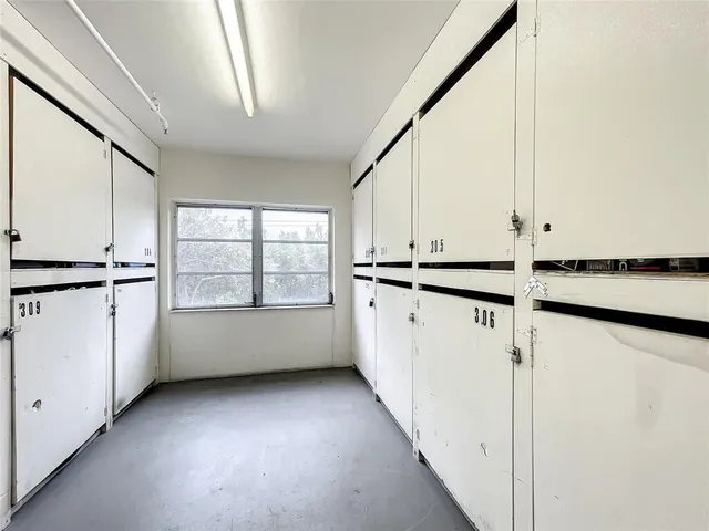 a hallway with cabinets