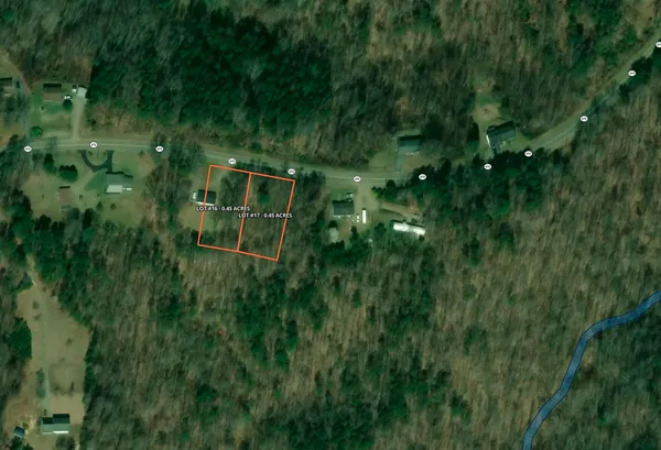 a backyard of a house with lots of green space and trees