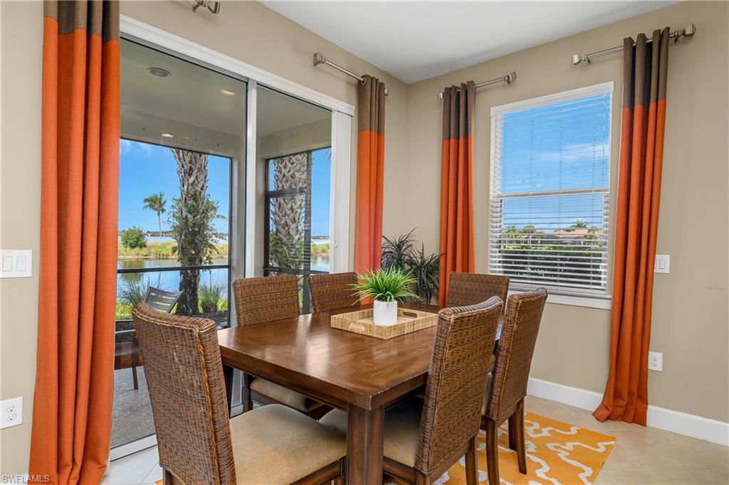 9064 Siesta Bay Drive, Unit 5102 Naples, FL 34120 - Photo 15 of 46 Entertain guests or enjoy family gatherings in the open dining space while taking in the amazing views beyond.
