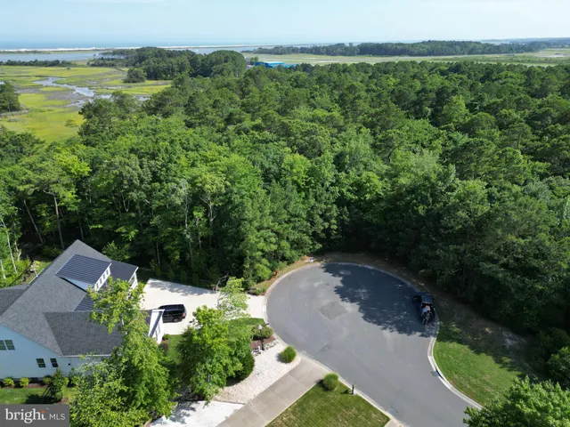 an aerial view of a house with pool outdoor seating and yard