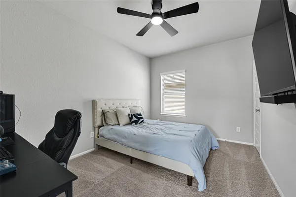 a bedroom with a bed furniture and a window