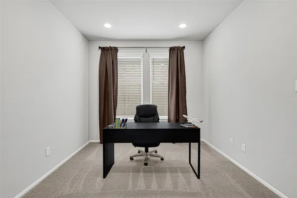 a view of a workspace with furniture