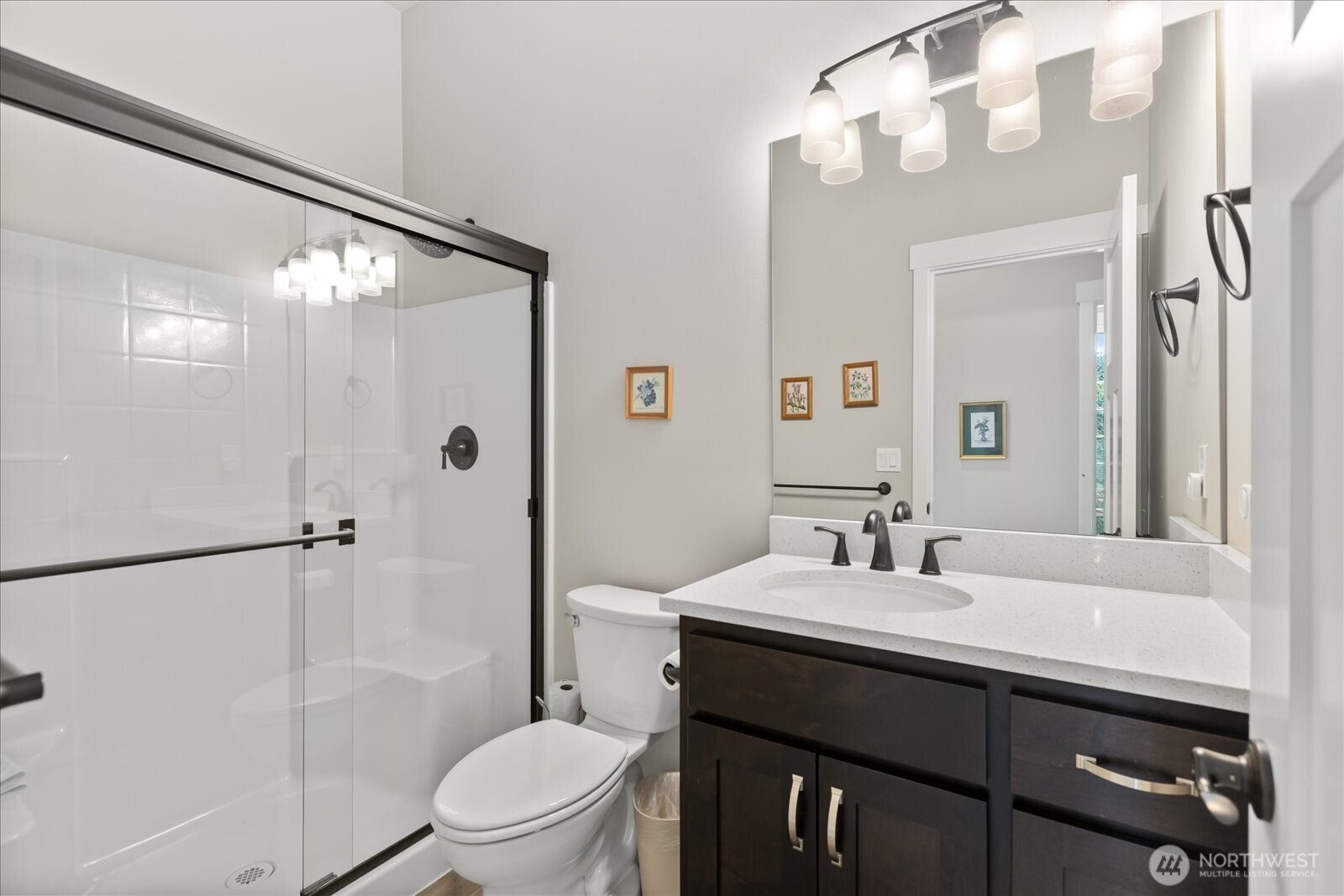 20434 Benson Ridge Mount Vernon, WA 98274 - Photo 16 of 31 a bathroom with a sink a toilet a mirror and shower