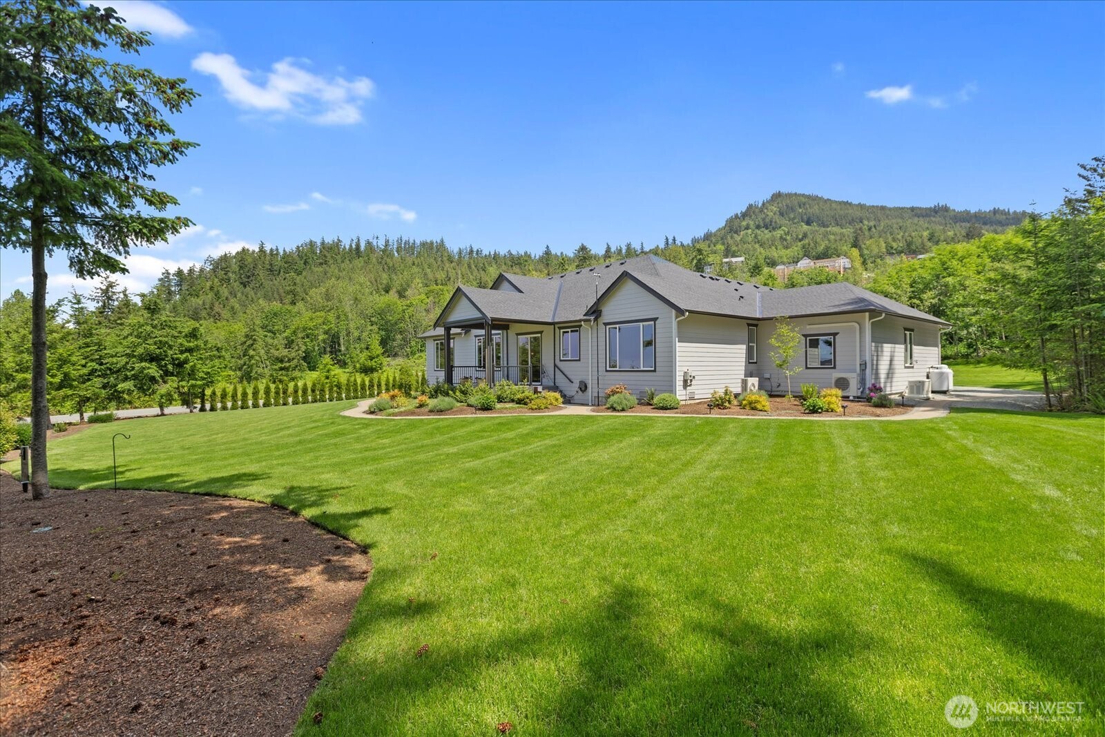 20434 Benson Ridge Mount Vernon, WA 98274 - Photo 22 of 31 a view of house that has a yard