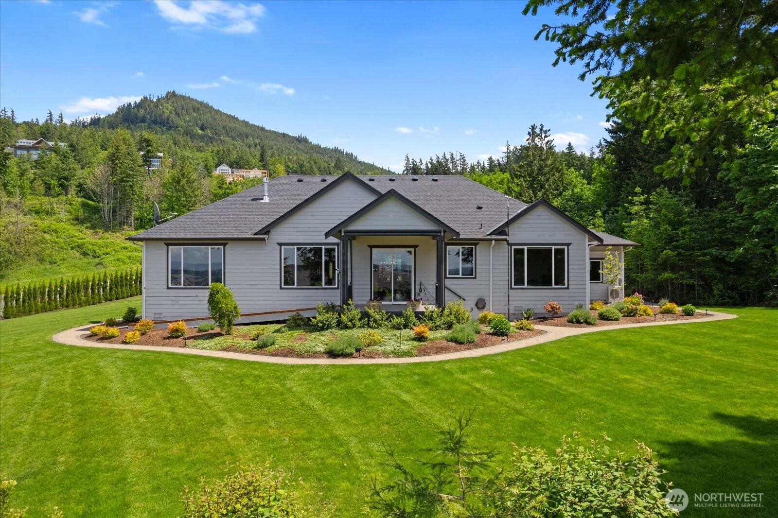 20434 Benson Ridge Mount Vernon, WA 98274 - Photo 23 of 31 a front view of a house with a garden and porch