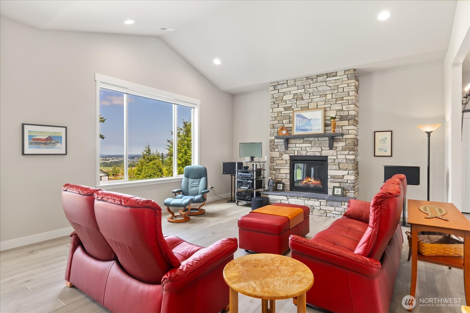 20434 Benson Ridge Mount Vernon, WA 98274 - Photo 8 of 31 a living room with furniture a fireplace and a table
