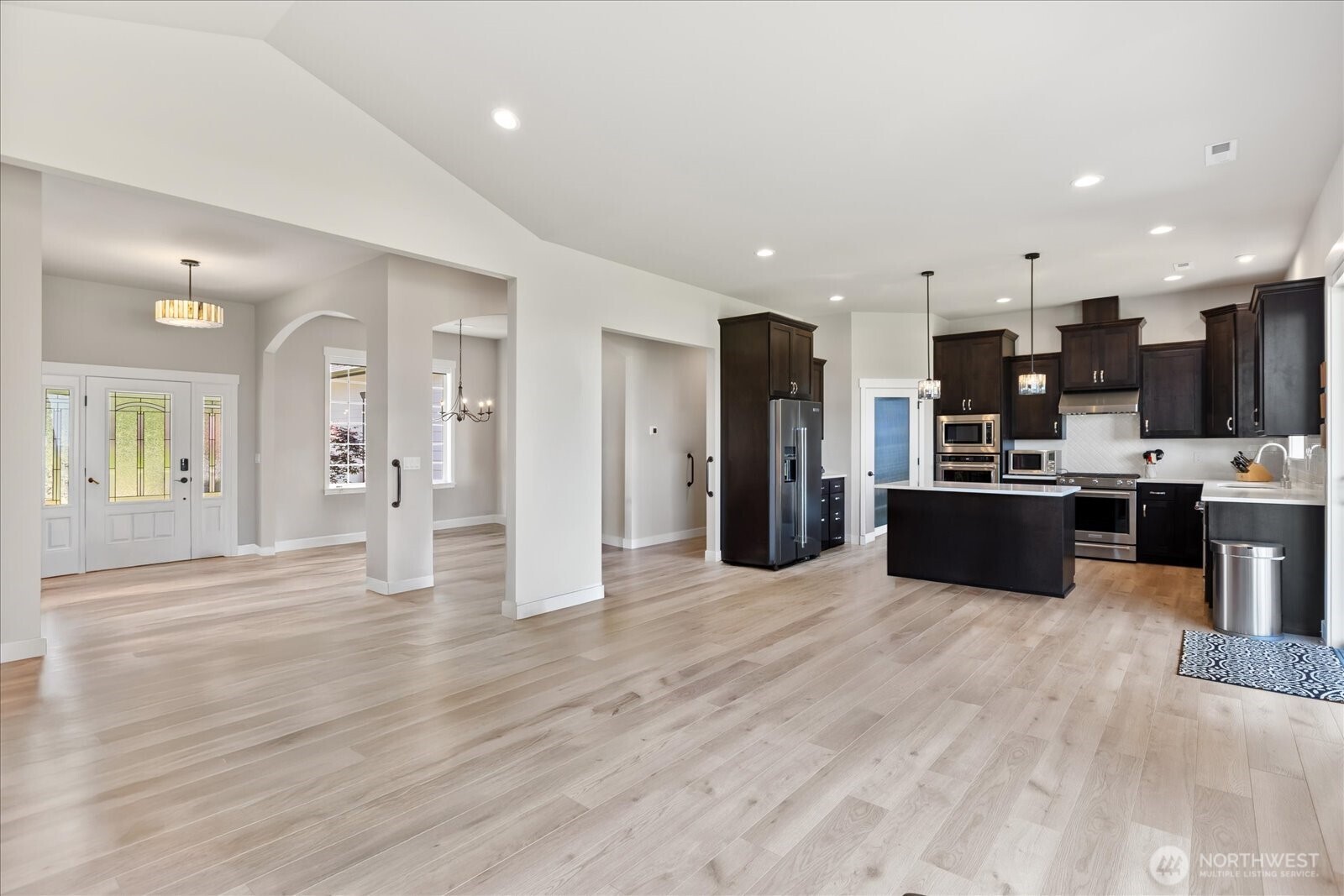 20434 Benson Ridge Mount Vernon, WA 98274 - Photo 10 of 31 a view of kitchen with stainless steel appliances kitchen island a refrigerator sink and cabinets
