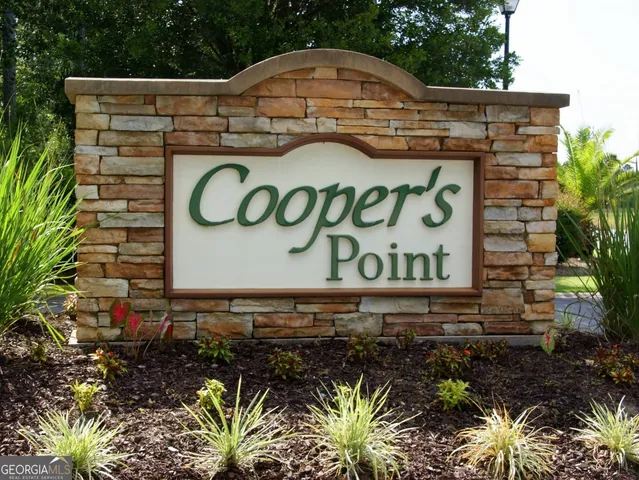 a sign that is on a brick wall