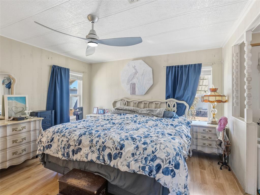 7402 Cascade Drive Hudson, FL 34667 - Photo 15 of 31 a bedroom with a bed and a dresser