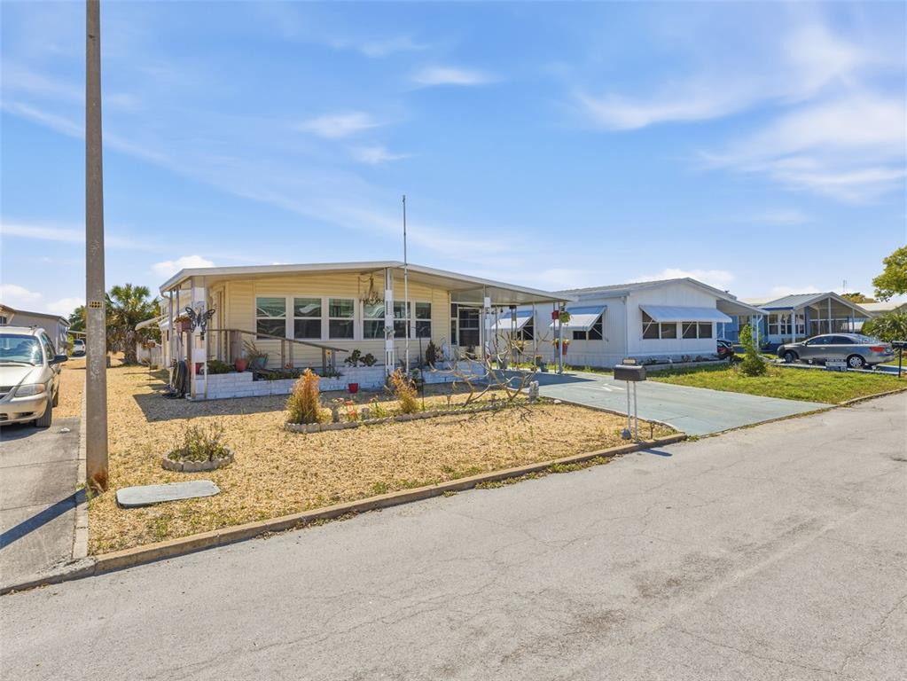 7402 Cascade Drive Hudson, FL 34667 - Photo 2 of 31 a view of swimming pool with outdoor seating