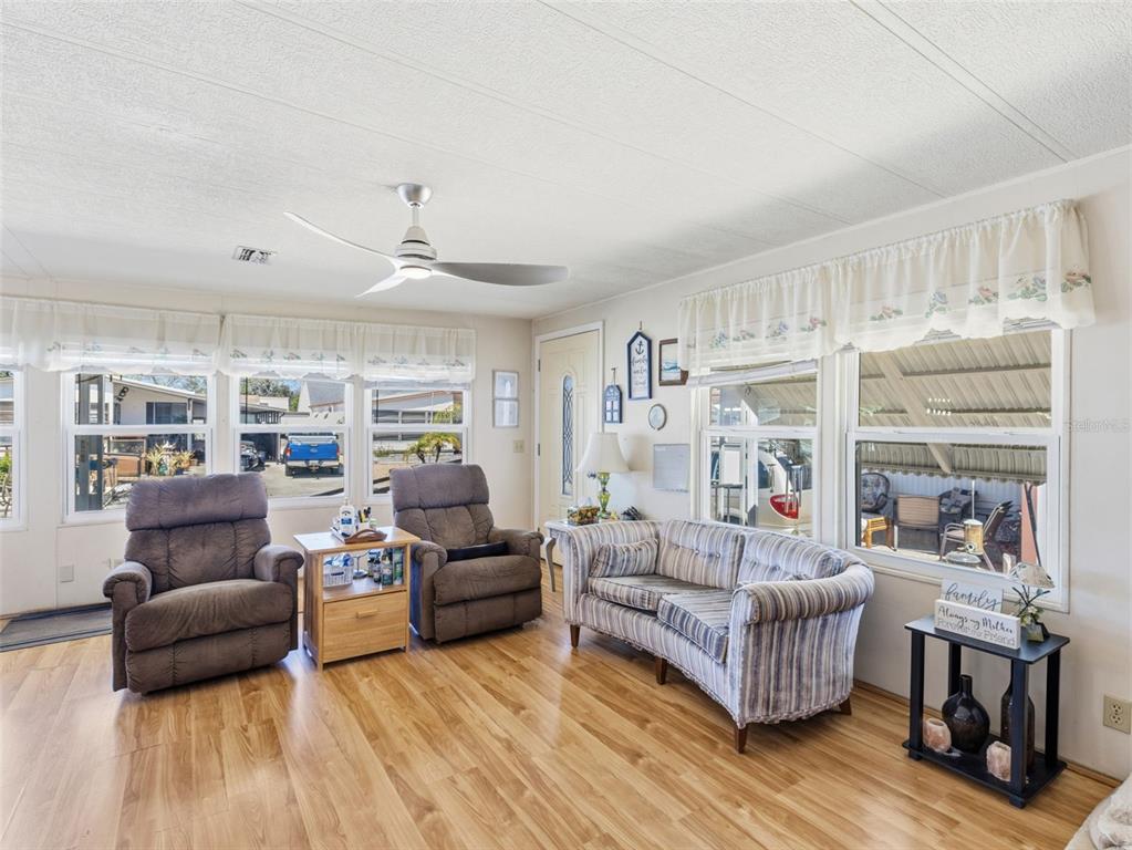 7402 Cascade Drive Hudson, FL 34667 - Photo 7 of 31 a living room with furniture and a large window