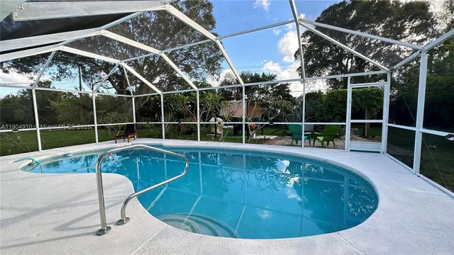 a view of a swimming pool with a porch
