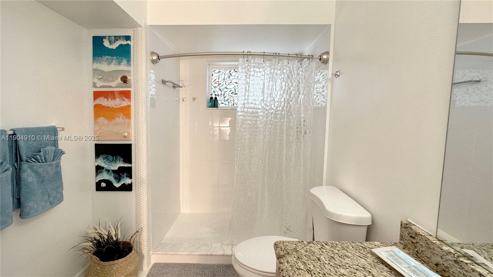 210 Banyan Drive Port St. Lucie, FL 34952 - Photo 17 of 22 a bathroom with a toilet and a shower