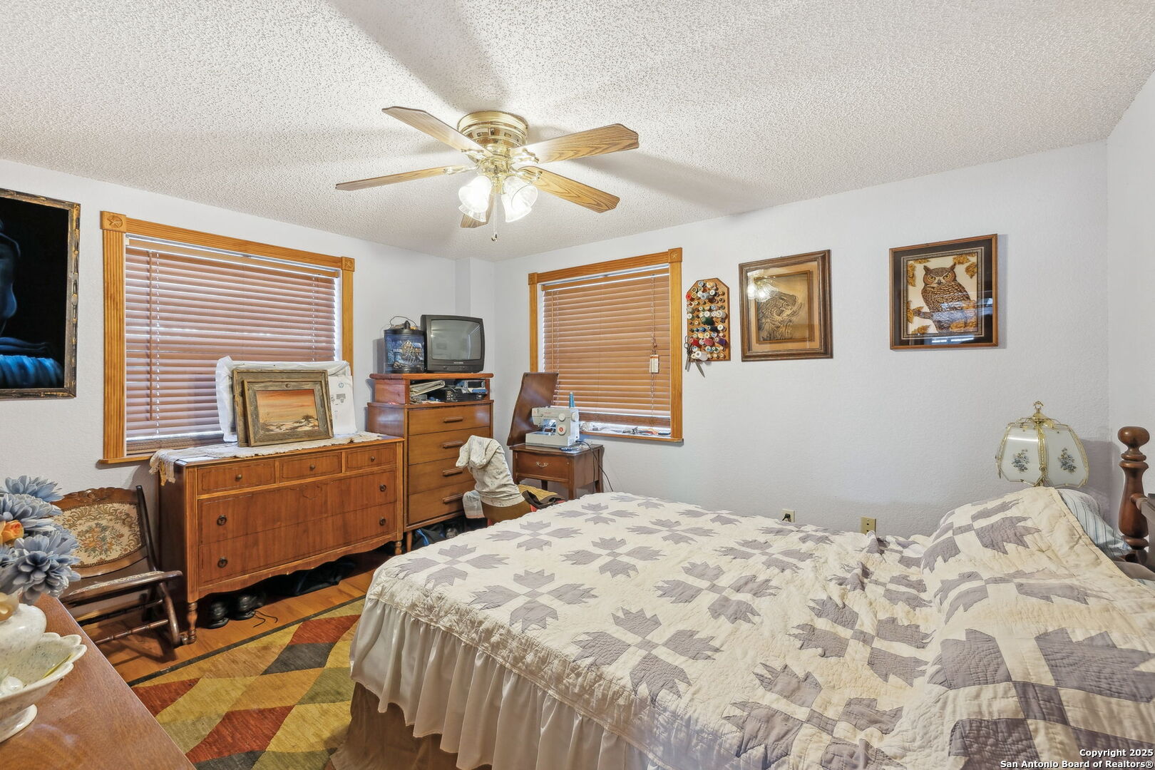 200 Highland Drive Bandera, TX 78003 - Photo 16 of 46 a bedroom with a bed and wooden furniture
