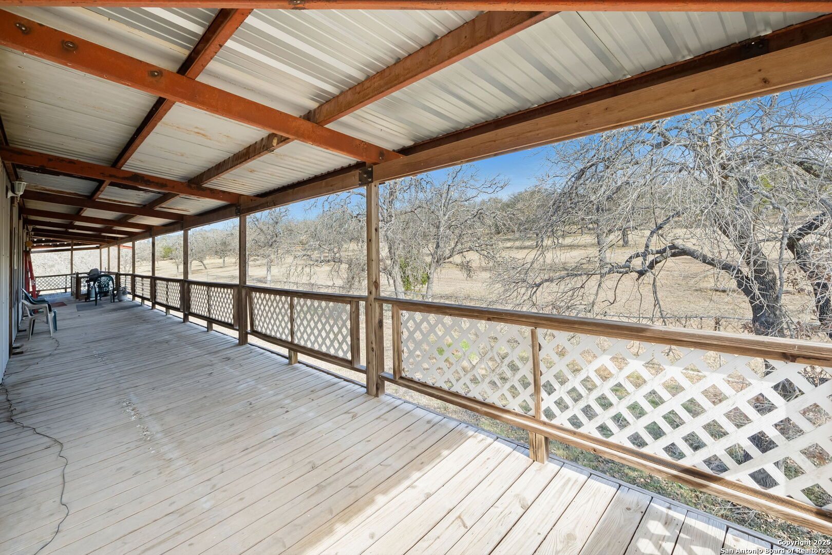 200 Highland Drive Bandera, TX 78003 - Photo 17 of 46 a view of wooden floor with a glass door