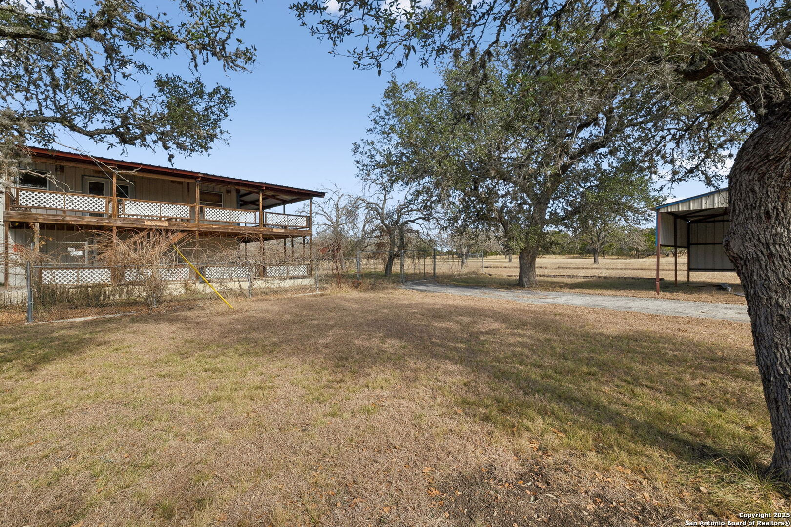200 Highland Drive Bandera, TX 78003 - Photo 21 of 46 a view of a yard with a tree