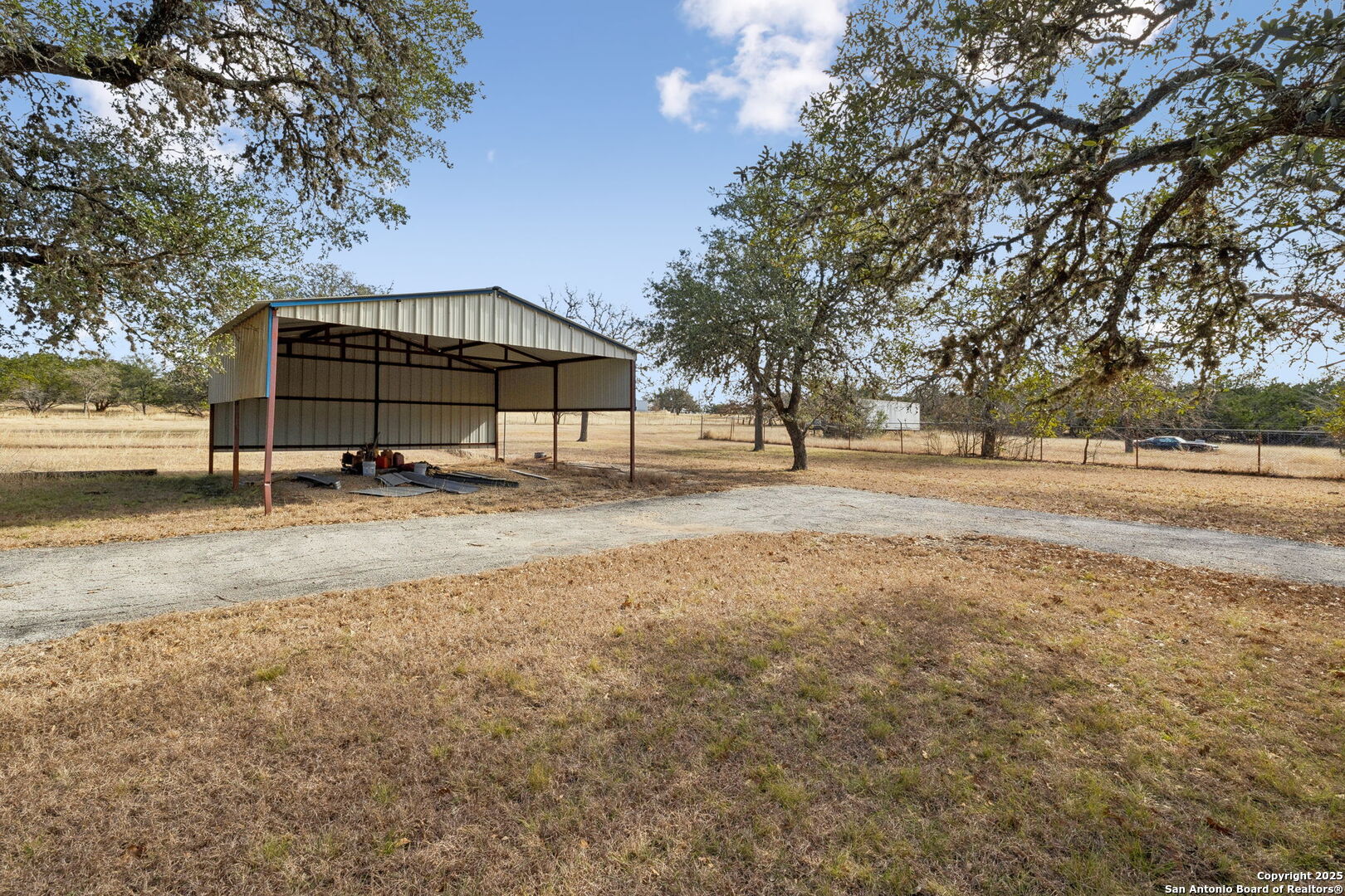 200 Highland Drive Bandera, TX 78003 - Photo 22 of 46 a house with trees in front of it
