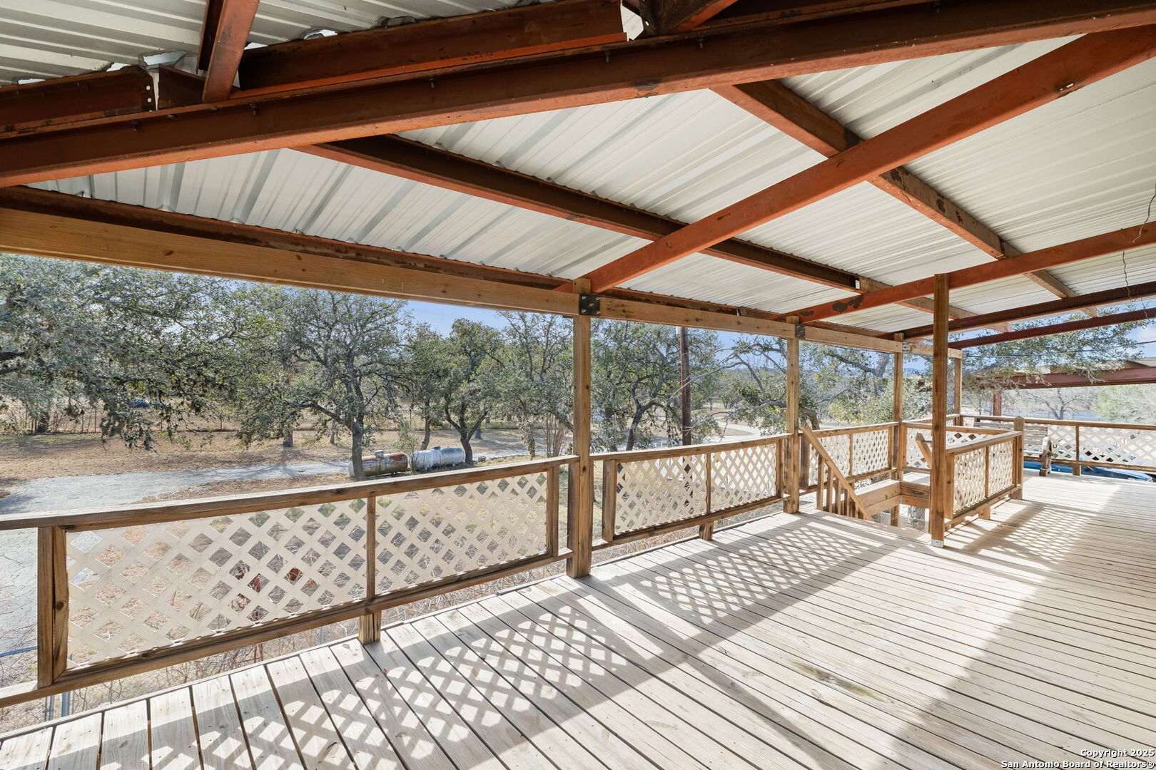200 Highland Drive Bandera, TX 78003 - Photo 26 of 46 a view of a balcony with wooden floor