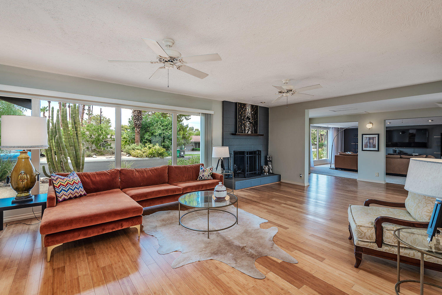 74111 Setting Sun Trail Palm Desert, CA 92260 - Photo 14 of 30 a living room with furniture and a fireplace