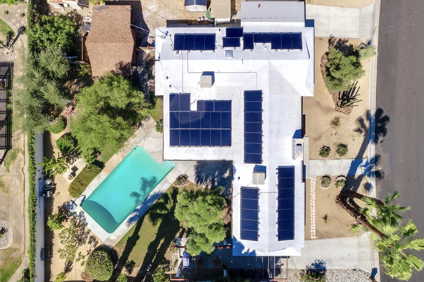 74111 Setting Sun Trail Palm Desert, CA 92260 - Photo 3 of 30 an aerial view of a house with a yard and garden