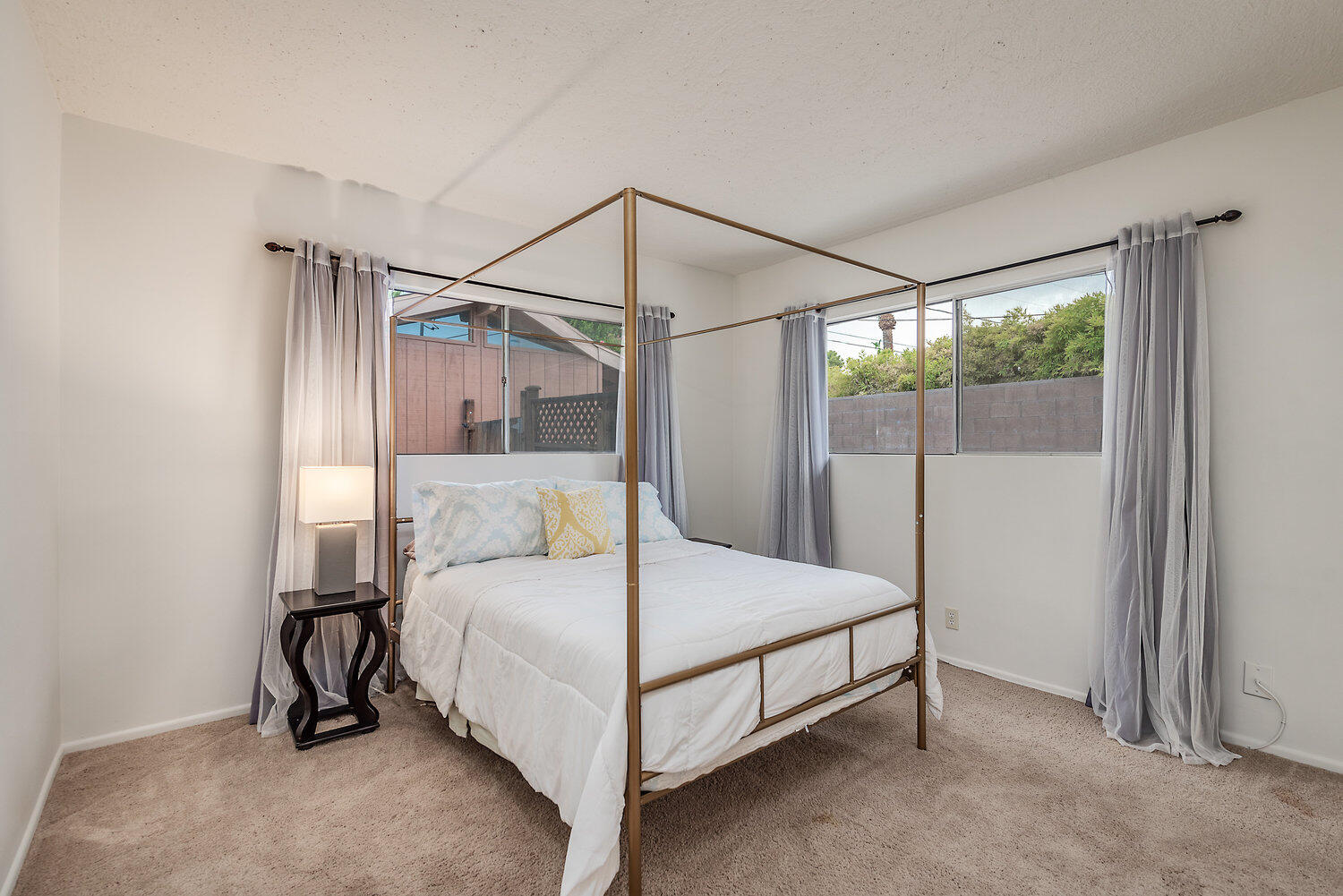 74111 Setting Sun Trail Palm Desert, CA 92260 - Photo 23 of 30 a bedroom with a bed and a mirror