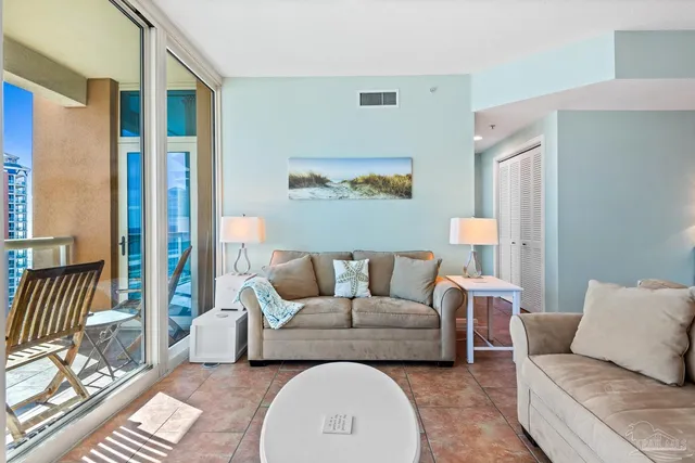 a living room with furniture and a large window