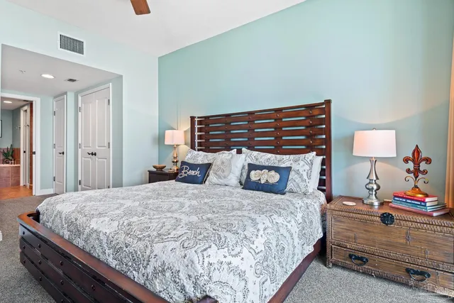 a bedroom with a bed and a lamp