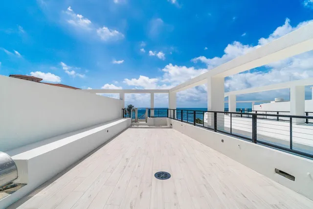 a view of a hall with kitchen