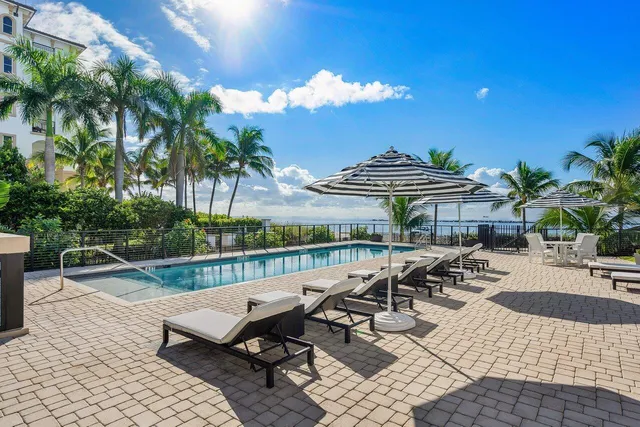 a view of a patio with table and chairs and potted plants