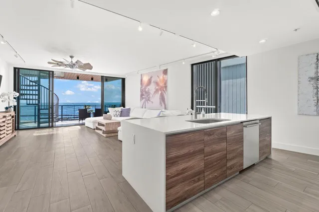 a spacious bathroom with a double vanity sink and a large mirror