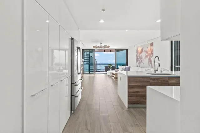 a view of a kitchen from the hallway