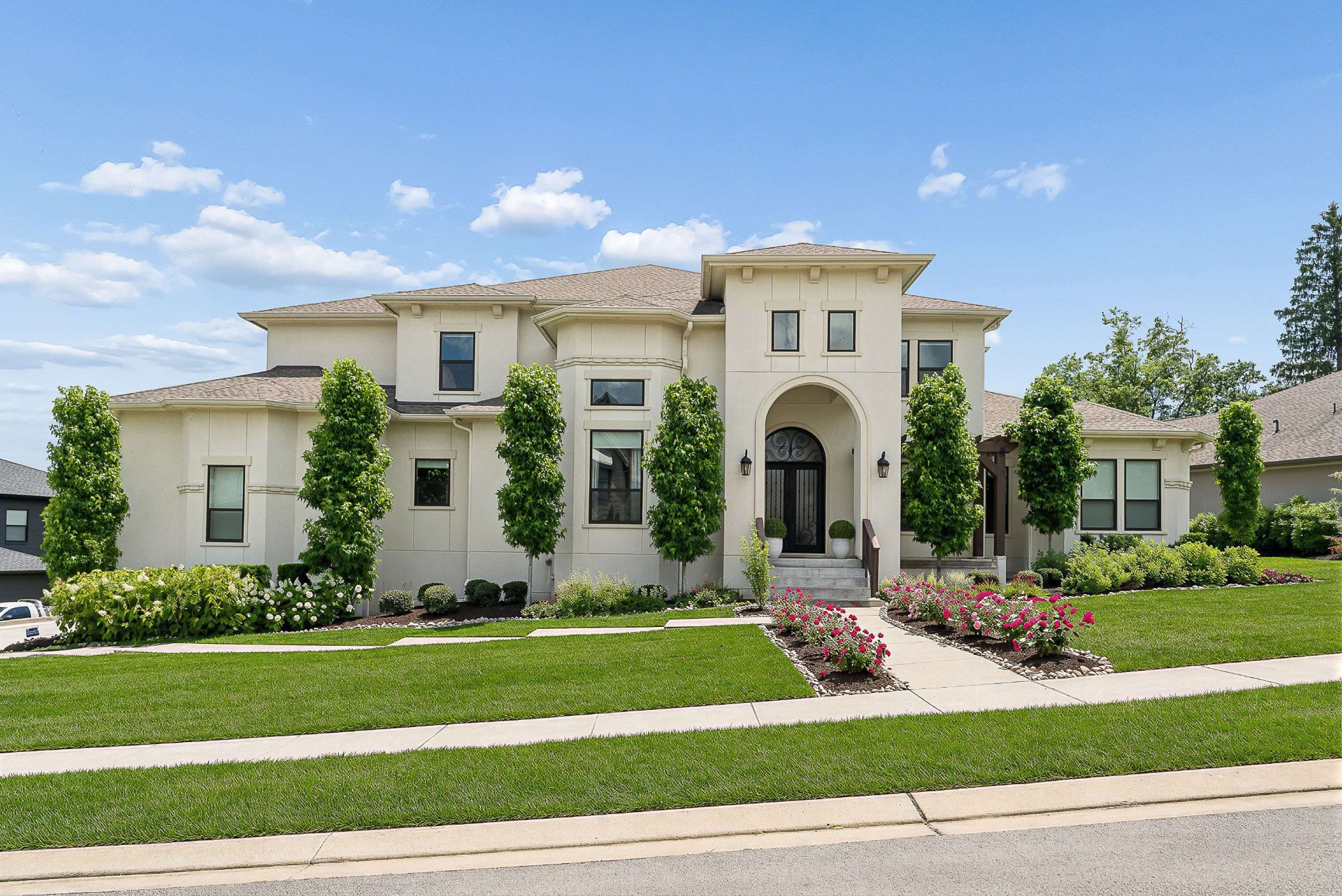 a front view of a house with a yard